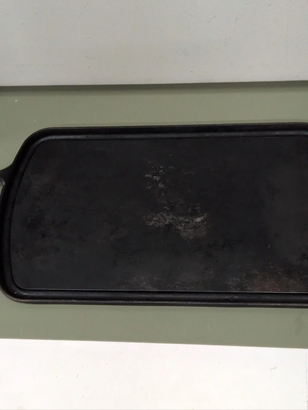 Field Company Long Cast Iron Griddle features a vintage-style .